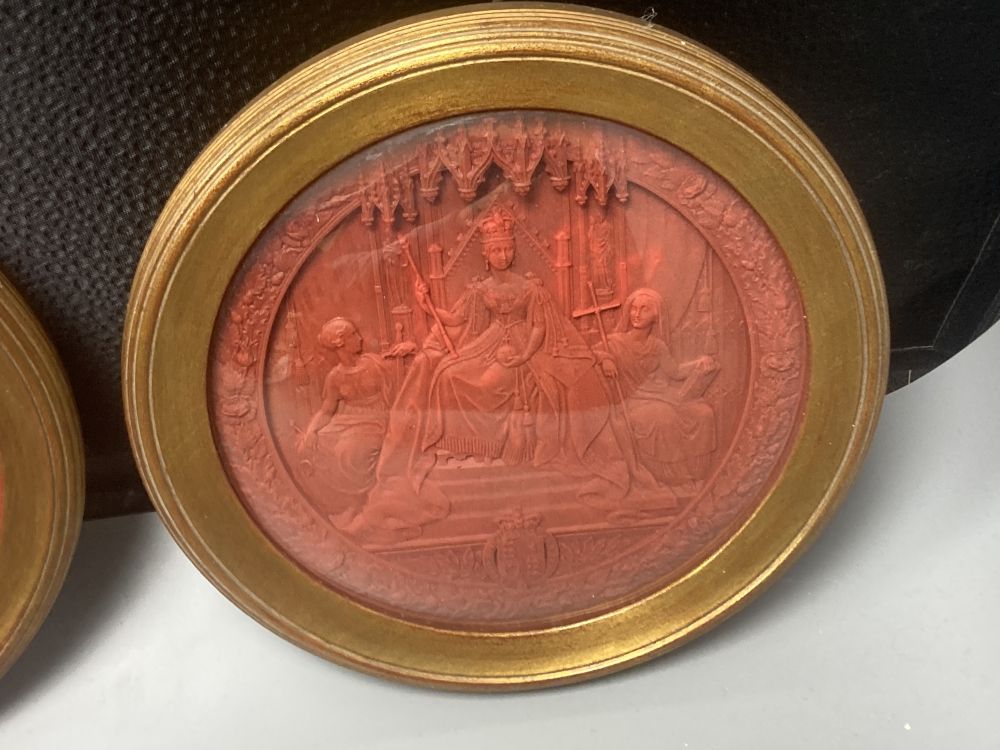 Two mid 19th century Great Seals of Queen Victoria, relief designs in red wax, later framed
